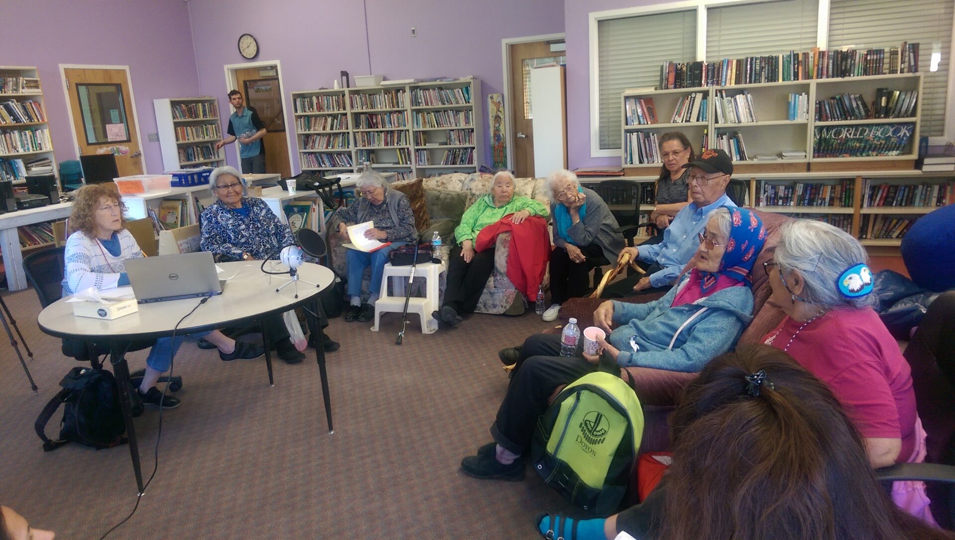 Elders gather in the Holy Cross school library to share language and stories