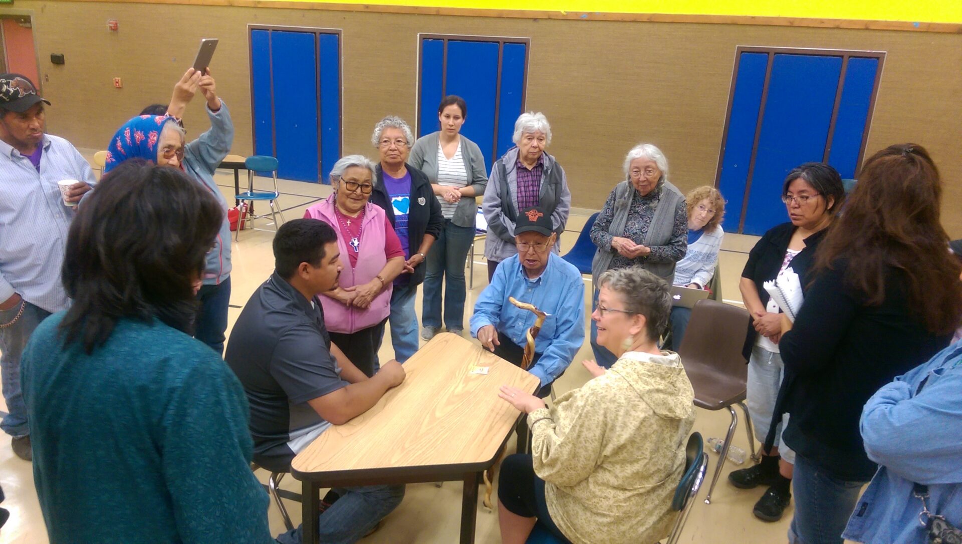 Participants playing the table top language learning game led by Susan Paskvan