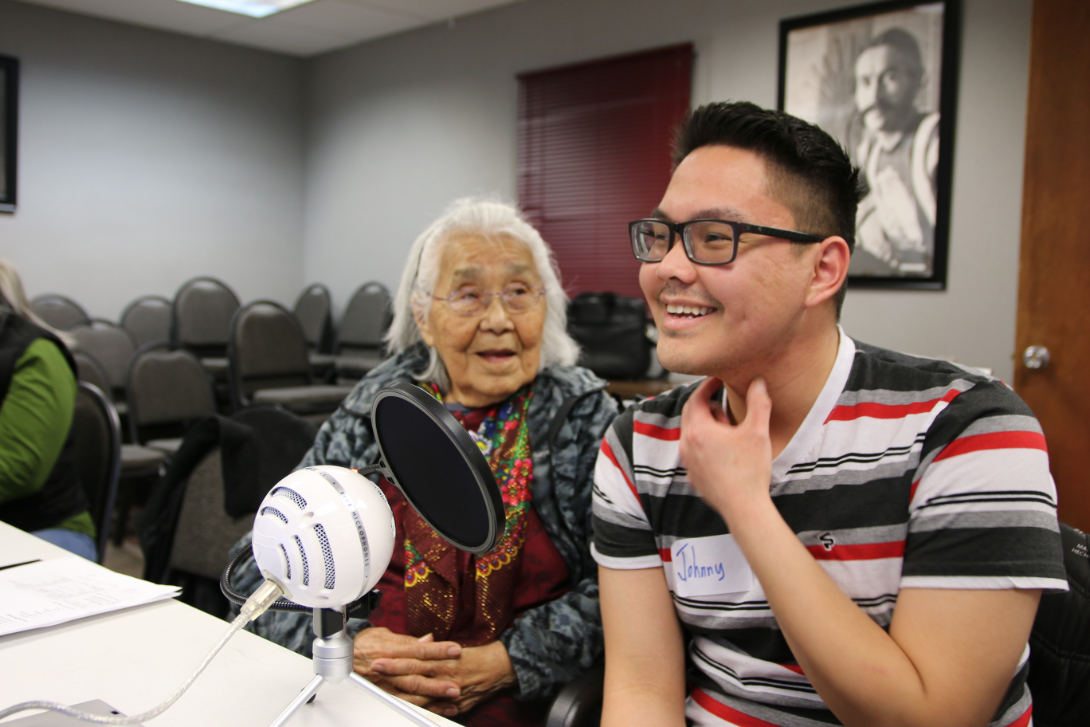 Elder and youth recording Native language translations